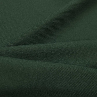 Ткань костюмная 21010 2076, 225 гр/м2, шир.150см, цвет т.зеленый - купить в Норильске. Цена 390.73 руб.